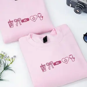 Coquette Bow Embroidered Nurse Sweatshirt, Soft Cotton Crewneck Womenswear, Cozy CNA or Nursing Student Gift for Her