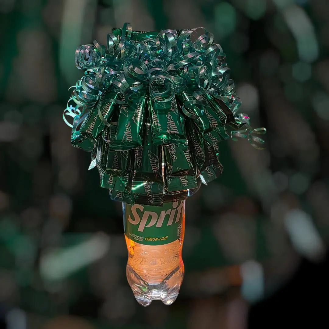 Mint Goodies Bouquet Set Atop Sprite Bottle with Green Ribbon Decor Perfect for Gift Giving and Special Occasions