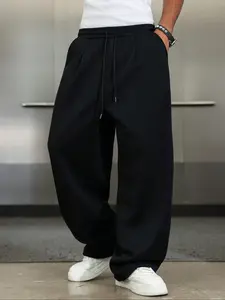 TikTok Trending! Black Solid Baggy Basic Sweatpants, Featuring a Loose Fit and Drawstring Waist, Perfect for Achieving a Stylish, Casual Streetwear Look When Paired with White Sneakers
