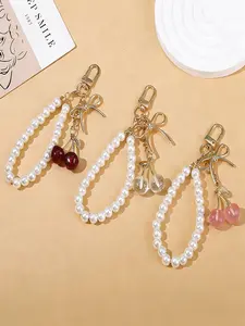 Bag Pendant New Cherry Bow Bag Charm Imitation Pearl Beaded String Cute And Sweet Elegant Temperament Exquisite And Beautiful High Quality Gifts For Friends And Birthday Gifts Bag Charms Accessory Fruit Bag Charm