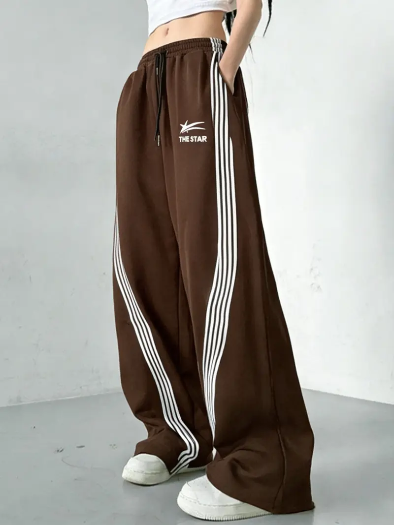Women's Wide-Leg Track Pants, elastic drawstring waist with contrast side stripes and "THE STAR" logo print, relaxed fit for streetwear, dance and casual daily wear, available in multiple colors