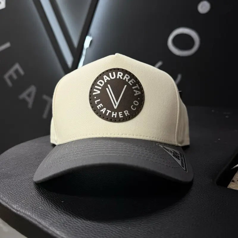 Vidaurreta Leather Co. Hat - Cream and charcoal Trucker Style with Distinct Logo Design