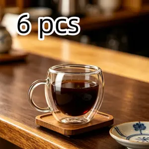 A set of 6 stackable double-walled glass espresso mugs, each 80ml, are heat-resistant, have non-slip handles, and are easy to carry, perfect for camping trips, small kitchens, and everyday coffee breaks.