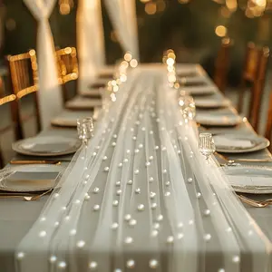 A white pearl beaded tulle, suitable for table runners, ceremony backdrops, home decor, room decor, birthday party decorations, and Valentine's Day ceremonies to create a romantic setting.Dimensions: 68*300cm/2.23*9.8 ft