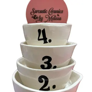 Hand made numbered measuring cup set. The set includes the following sizes: quarter, third, and half of a cup, plus 1 cup. Each side has a number 1-4 glazed on to it.