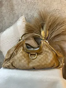Pre-owned GUCCI large shoulder bag in warm camel leather, featuring the iconic all over GG embossed monogram 1919