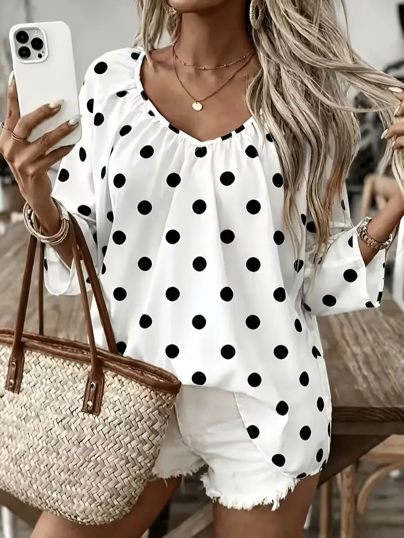 Plus-size Western-style women's fashion T-shirt featuring a deep V-neck, polka-dot print, and 3/4-length sleeves—a wardrobe essential.