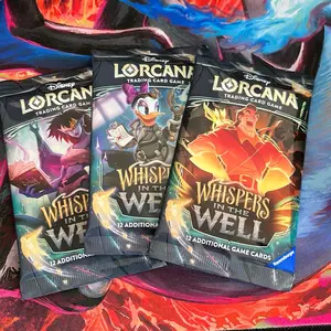 Lorcana whispers in the well booster pack