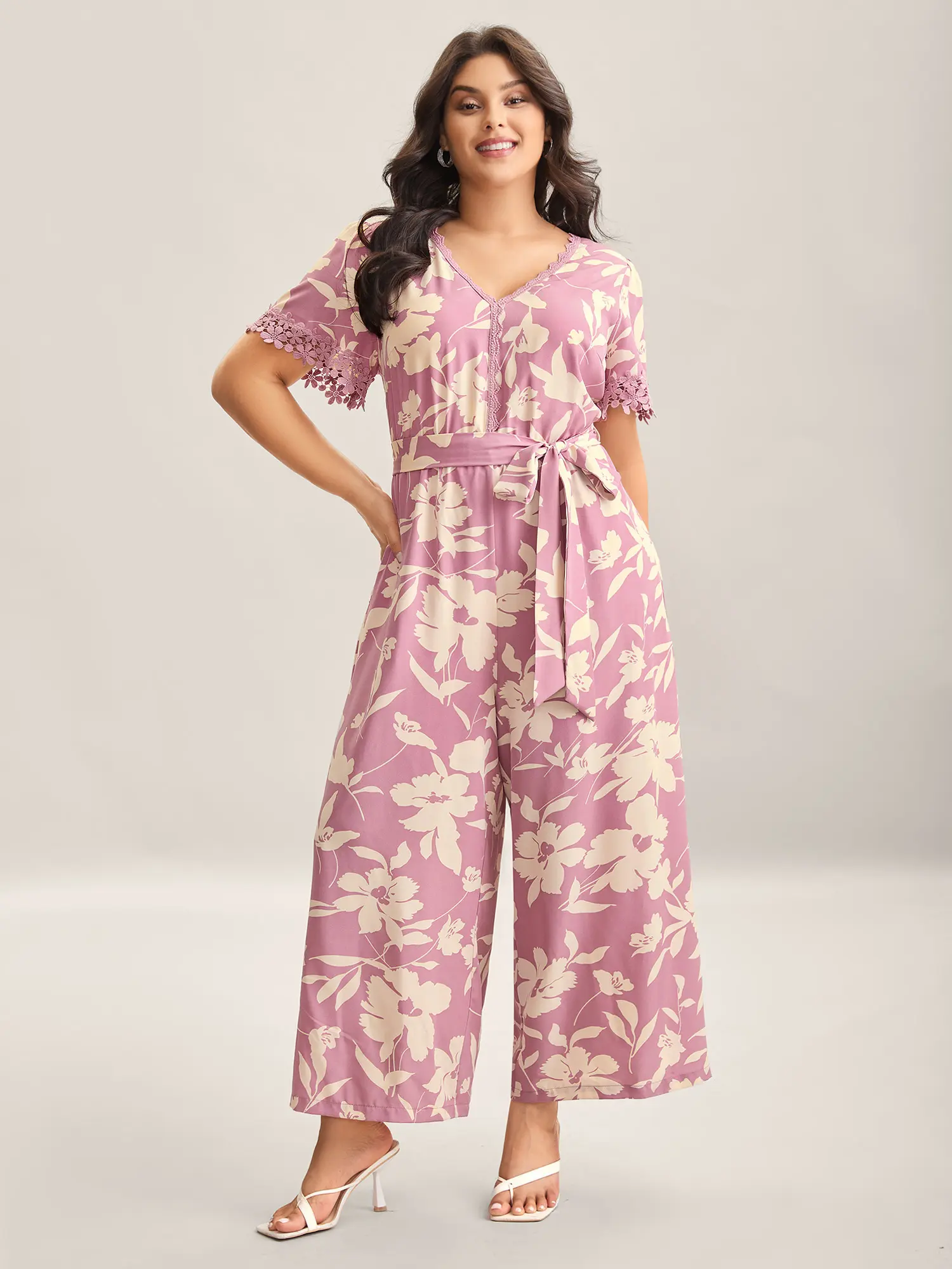 BloomChic Women's Plus Size Floral V-Neck Jumpsuit - Short Sleeve Belted Tieback Cinch Garment with Pockets, Polyester-Spandex Smooth Fabric, Low Iron, Blush Pink, Maxi Length Coverage, V-Neck Elegance, Belted for Fit