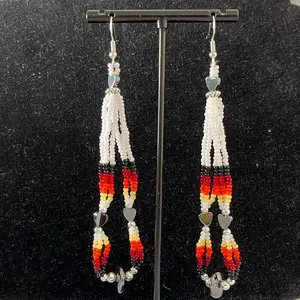 Navajo handmade beaded earring adorned with white seed beads with a fire designed seed beads and heart shaped hematite.