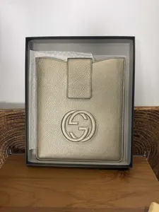 Pre-owned GUCCI Metallic Gold Pebbled Leather Clutch with Embossed Interlocking GG Logo
