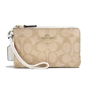 COACH Corner Zip 16 Double-Layer Monogram Coated Canvas Wristlet Clutch for Women in Light Khaki with White