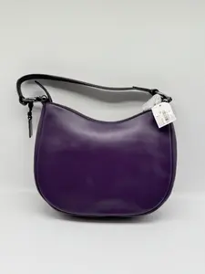 Coach Nomad Hobo handbag in purple leather.