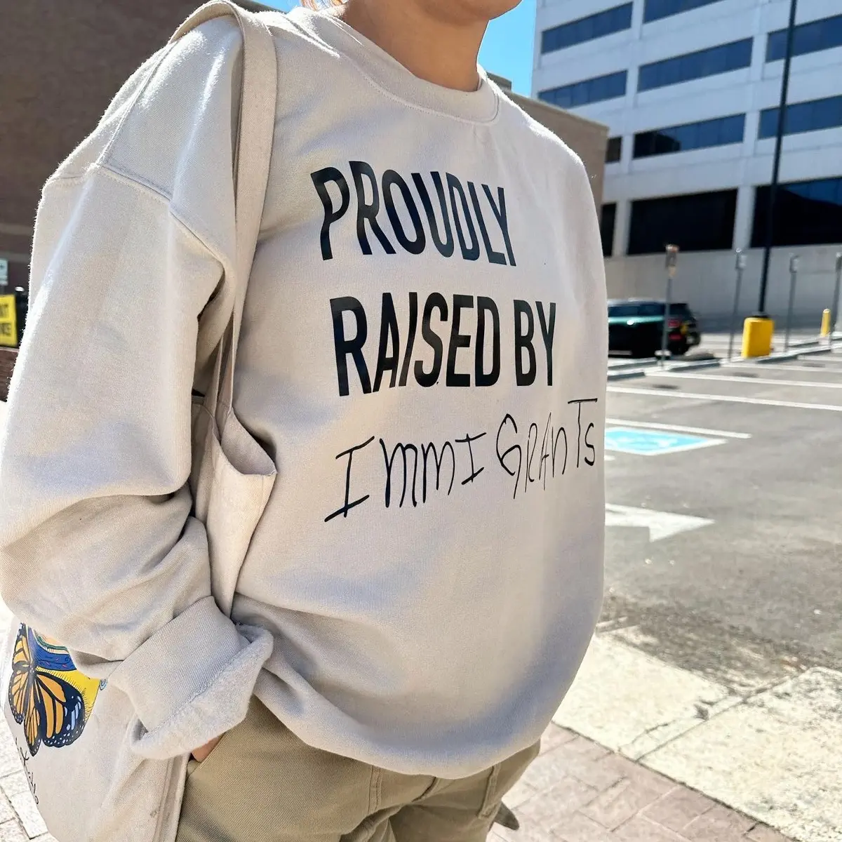Proudly Raised By Immigrants Sweatshirt