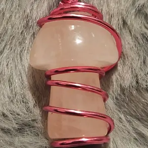 Handcrafted Wire Wrapped Rose Quartz Pendant with Red Coiled Design for Healing and Aesthetic Appeal
