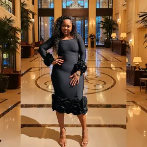 CAMELLE a black long-sleeved midi dress