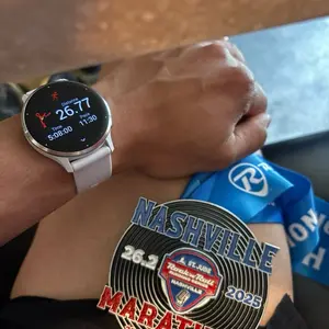 Garming Venus 3 Watch Displaying 26.77 Distance Time 11:30 Nashville Marathon 2025 Ribbon