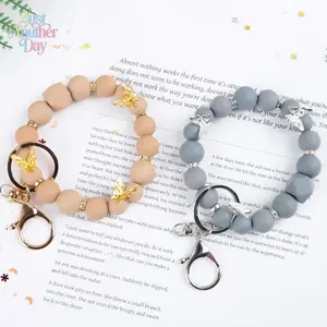 Hot Pink Beaded Keychain Wristlet with Silver Butterfly Charms Matte Silicone Beads and Geometric Bead Stylish Bracelet Keyring for Keys Bags and Phones Trendy Y2K Accessory Perfect Gift for Women Lightweight and Durable Easy to Wear and Secure