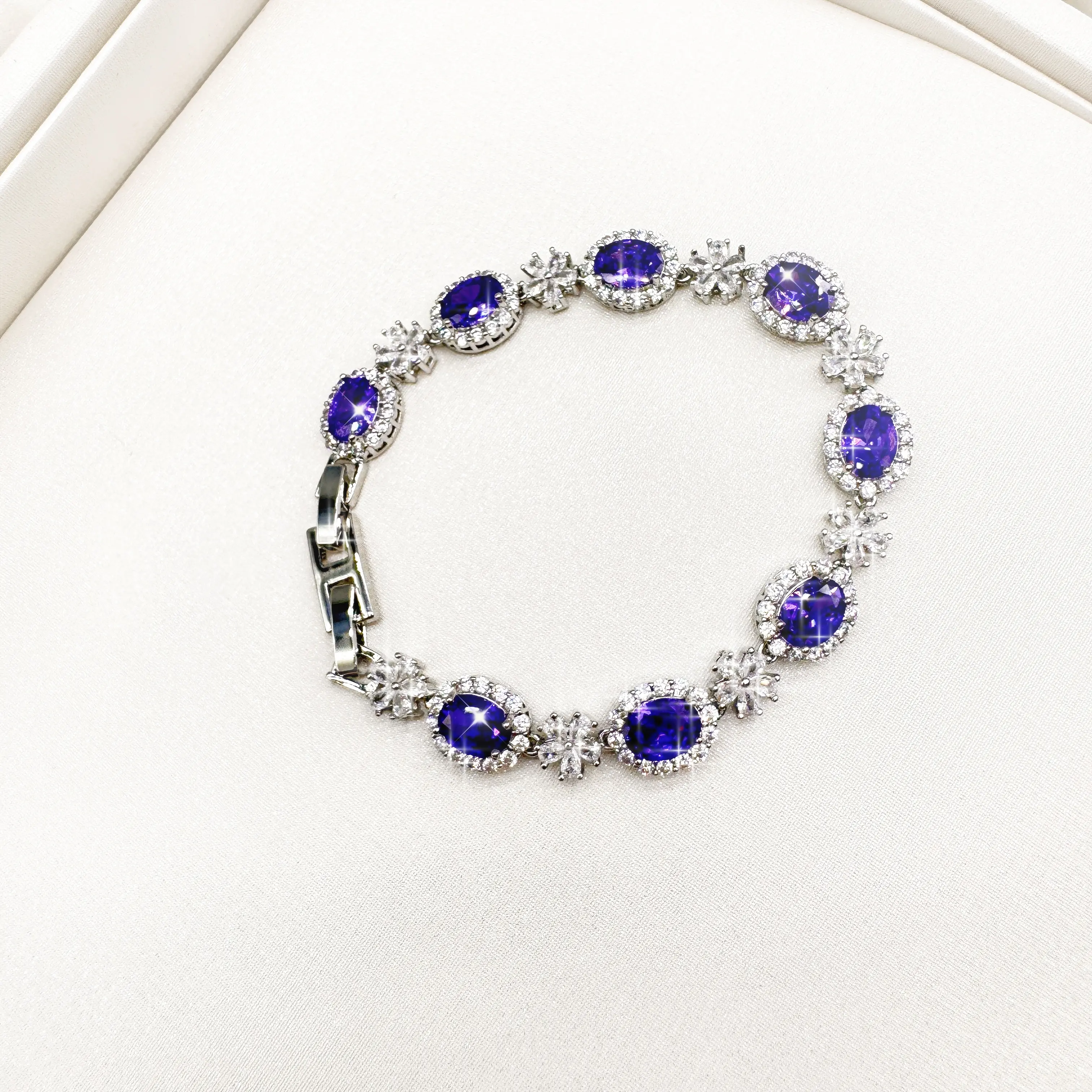 Luxurious floral pattern purple diamond bracelet with zirconium dioxide and copper. Elegant flower design exudes a sense of refinement. Perfect for everyday wear, dates, anniversaries, and stylish accessories for women. A premium gift.