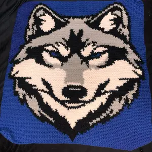 Wolf Tapestry - Handmade Crochet Wall Hanging with Blue Background and Detailed Wolf Design