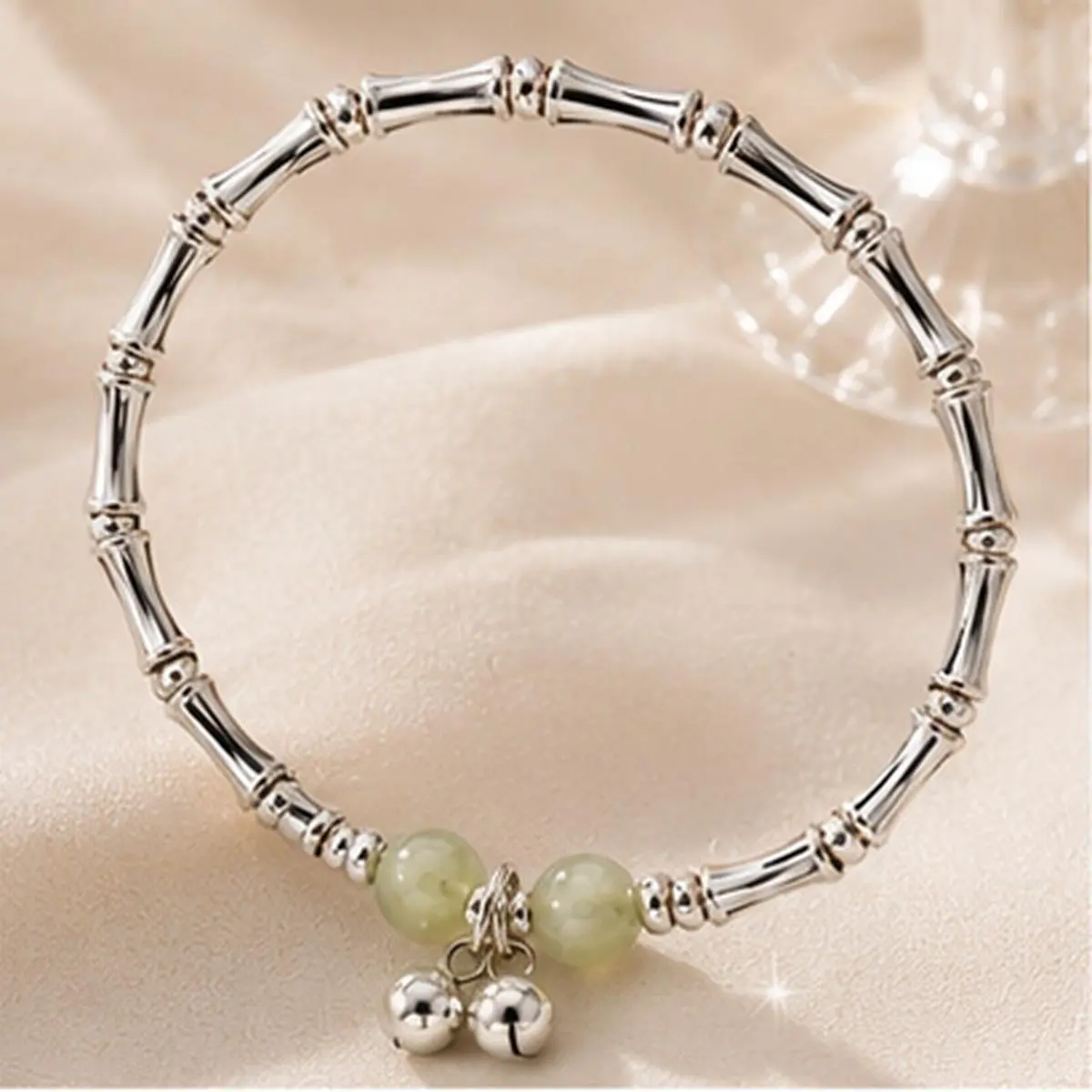 Women's Silver-Tone Plated Alloy Bamboo Link Stretch Band Bracelet - Light Green Beads, Segmented Tubes, Double Bells Charms, Minimalist Vintage-Inspired Costume Jewelry for Everyday Wear, Gifting