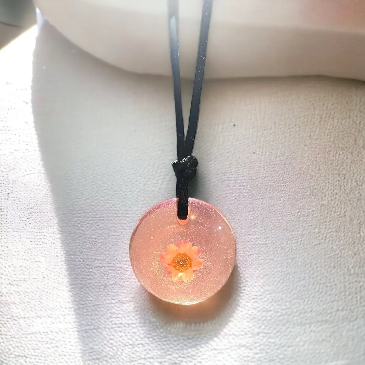 Light pink resin necklace with real flower inside