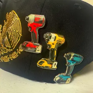 Pin Taladro Chava Hats - Tool Design Pin Featuring Three Different Drill Models on a Hat
