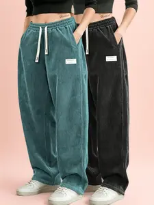 Women’s dark green corduroy two-piece set — high-waisted drawstring loose wide-leg casual pants, suitable for home and light activewear; smooth drape and texture, minimalist women’s piece. Black Aesthetics