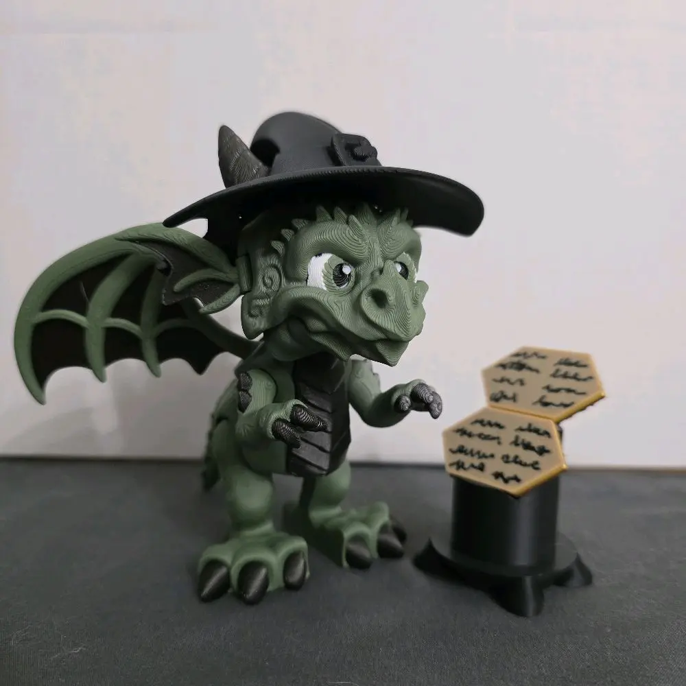 Elphaba inspired articulated dragon with grimmerie and stand.