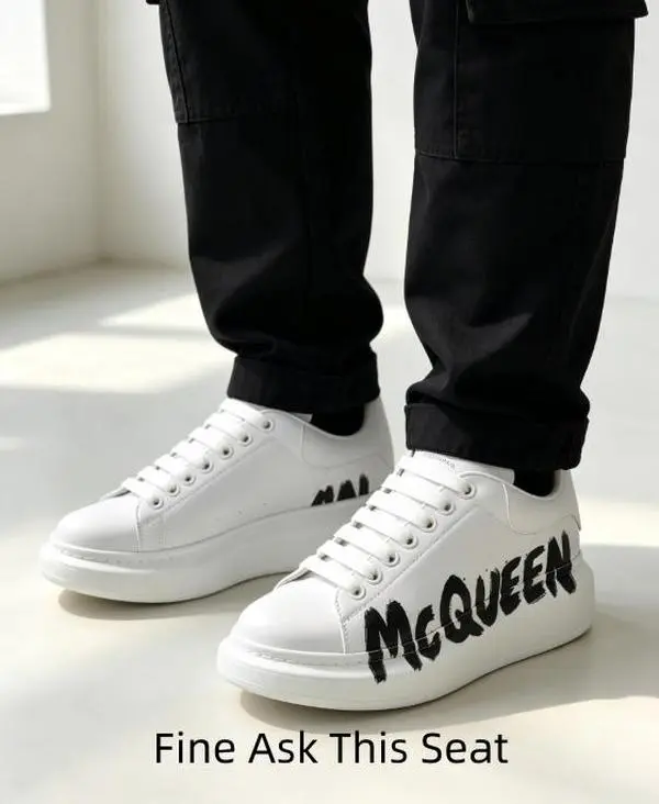 Versatile graphic print white platform trainers with stain-resistant smooth leather surface, solid white chunky cushion midsole, bold black side letter design to pair skinny jeans, midi skirts, shorts and oversized loungewear