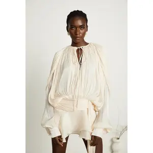 Fully-pleated ruffled mini dress in Neutrals