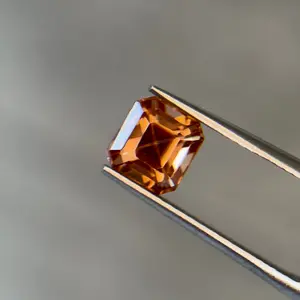2.40 ct Natural Zircon Brownish Orange – Emerald Cut – AIG Certified