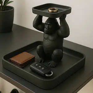 A bold and practical key tray designed to add personality to your space. This piece features a sculptural black gorilla figure holding the tray, combining practical storage with unique decoration. Perfect for holding keys, rings, Funny home decor