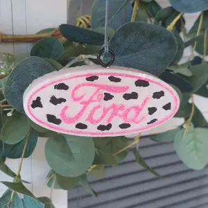 Ford Cowprint Car Freshie - Black Cowprint Design with "Ford" Text, Circular Shape, Ideal for vehicles and small spaces.