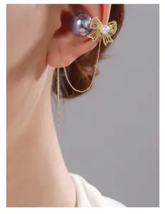 Includes shipping fee. New second‑generation universal ear clip design with pearl bow detail, anti‑loss, Huawei‑compatible earphone clip with rhinestone buckle, original niche fashion.