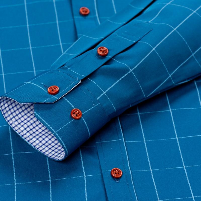 Men’s long-sleeve shirt with four plaid color-block panels, business-casual style. Button-down notched collar design for a sharp look, red buttons add refined details, blue-and-white plaid interior provides visual depth. Long-sleeve fit suitable for multi