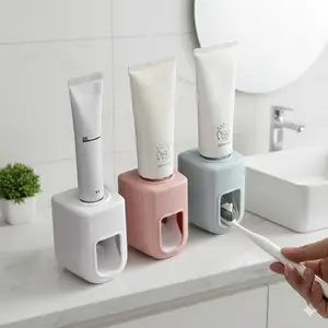 Smart Press Automatic Toothpaste Dispenser: One-Touch Squeeze, No Install Needed. Wall-Mounted Bathroom Organizer with Strong Adhesive, Fits Electric/Manual Toothbrushes. Maximize Vertical Space in Your Vanity.