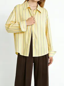 A women's fashionable yellow and blue striped loose long sleeved shirt, with a refreshing stripe design and a loose fit that covers the skin. It is suitable for commuting to work, shopping and outdoor activities, indoor and outdoor dressing