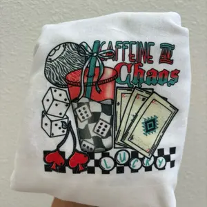 Caffeine and Chaos Checker Coffee Tee - Women's Top with Graphic Design Featuring Dice, Cards, and "LOVE" Text - Womenswear