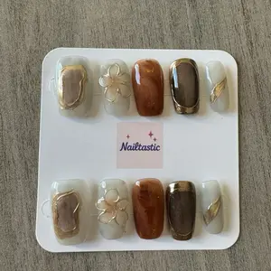 Nailtastic Handmade Press-On Nails with Gold Accents and Floral Design for Elegant Manicure