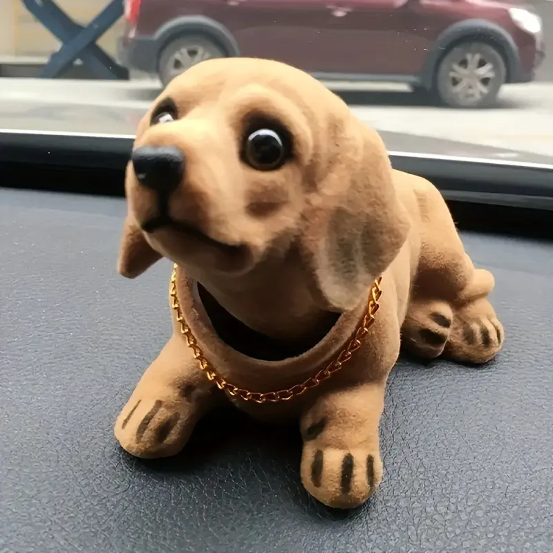 Car interior, interesting items in the car: cute resin shaking dog, stirring every journey