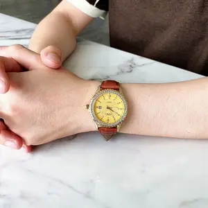 Stunning Gold Dial Women’s Watch with Crystal Bezel Brown Leather Strap, Elegant Diamond Accents, Timeless Luxury Style, Perfect for Everyday & Special Occasions