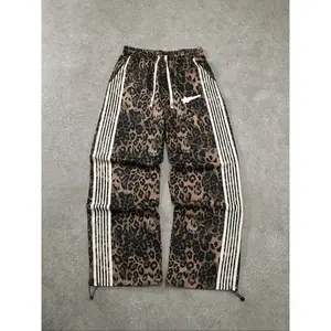 Men’s casual loose joggers with meteor print, adjustable drawstring waist, and leopard print; suitable for all seasons. GARMENTARY