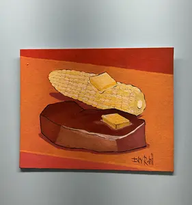 Steak and corn with two pads of butter