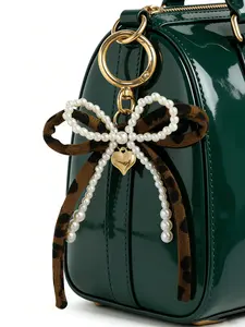 Leopard print bow bag charm keychain, pearl bow decoration with a gold heart pendant, women's leopard print and faux pearl bow heart-shaped keychain, light gold round spring clasp design, suitable for a backpack, Purse Accessories