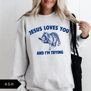 Jesus Loves You and I’m Trying Sweatshirt/ T-shirt, Funny Christian Pullover, Vintage Raccoon Graphic Top, Retro Faith Humor Shirt, Sarcastic Gift Sweater