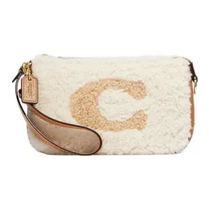 COACH Nolita 19 Logo Charm Faux Fur C-Zip Wristlet in White and Brown Leather for Women