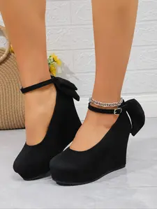 Black matte stiletto heels with a single ankle strap design, featuring a three-dimensional bow at the back. Ideal for petite women looking to add height, these shoes offer stable walking and are perfect for dates, afternoon tea, and other occasions.