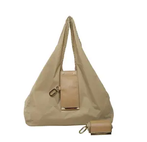 Compact Foldable Keychain Bag, waterproof, expandable into a large-capacity tote bag/shopping bag, durable, convenient, and reusable, suitable for fitness, grocery shopping, and travel.