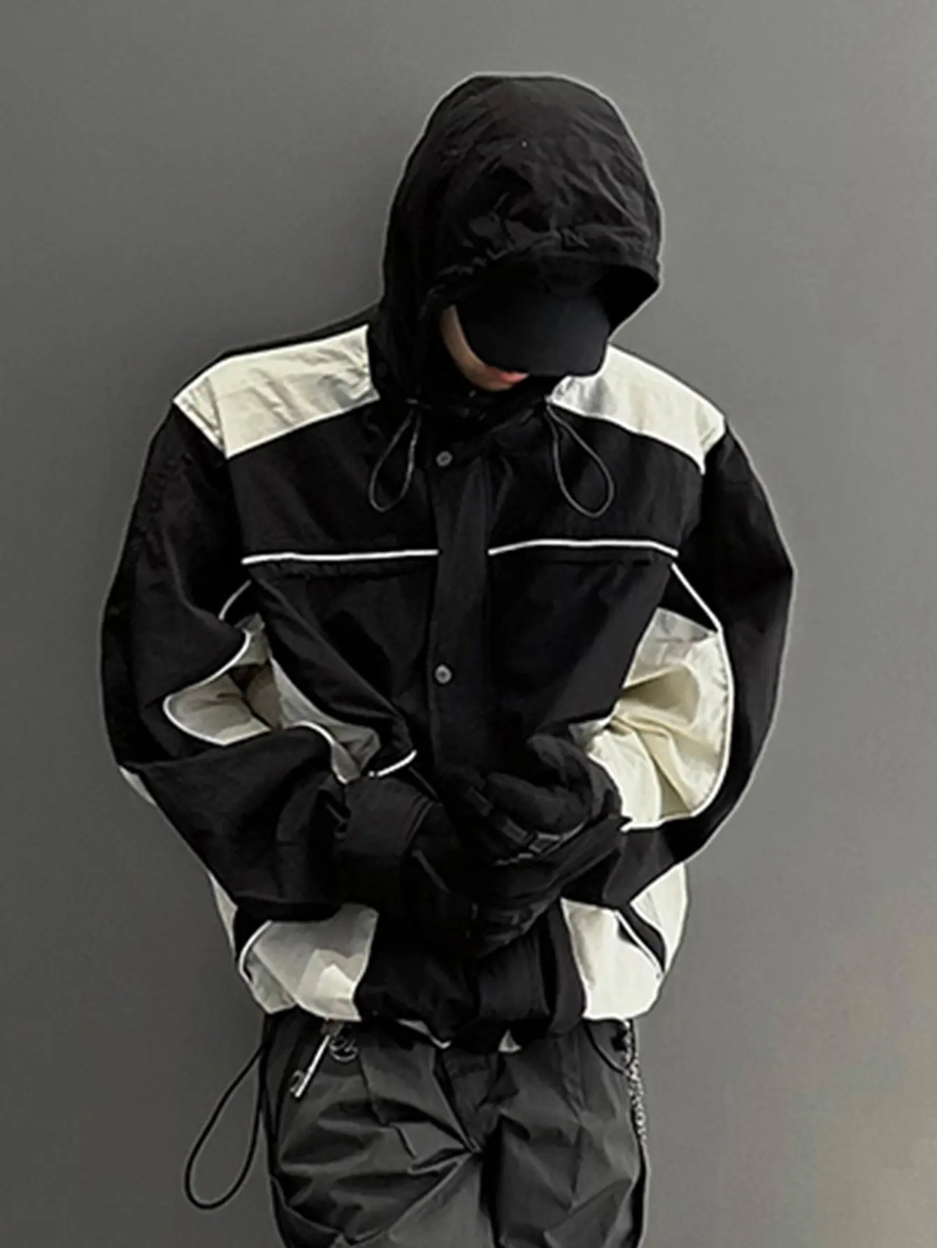 Color-block hooded functional jacket with a drawstring waist, street-style trendy windproof outerwear.